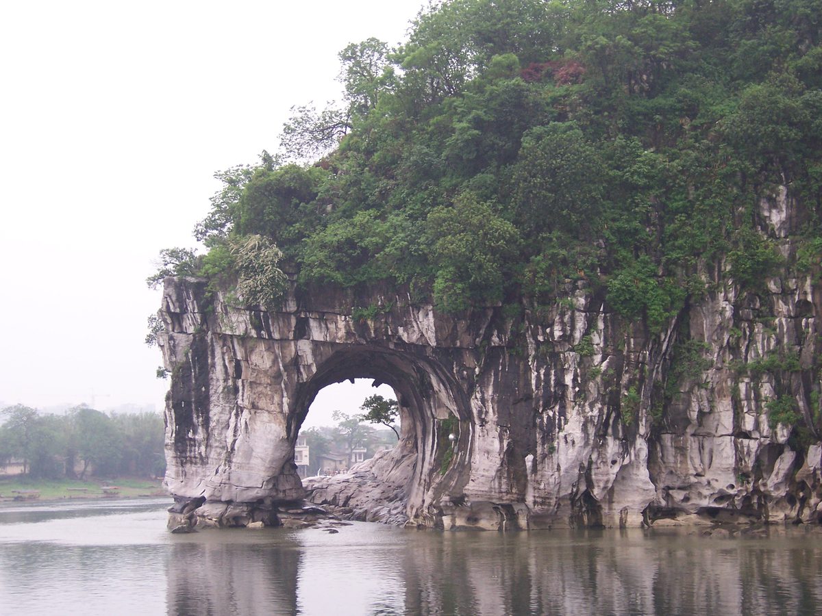 Elephant Trunk Hill, its natural arch reflected in the Li River