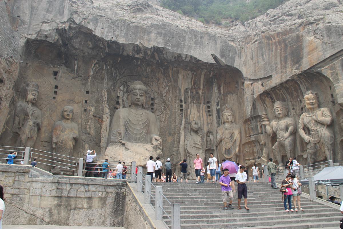 The colossal Vairocana Buddha and guardians of the Fengxian Temple niche at the Longmen Grottoes