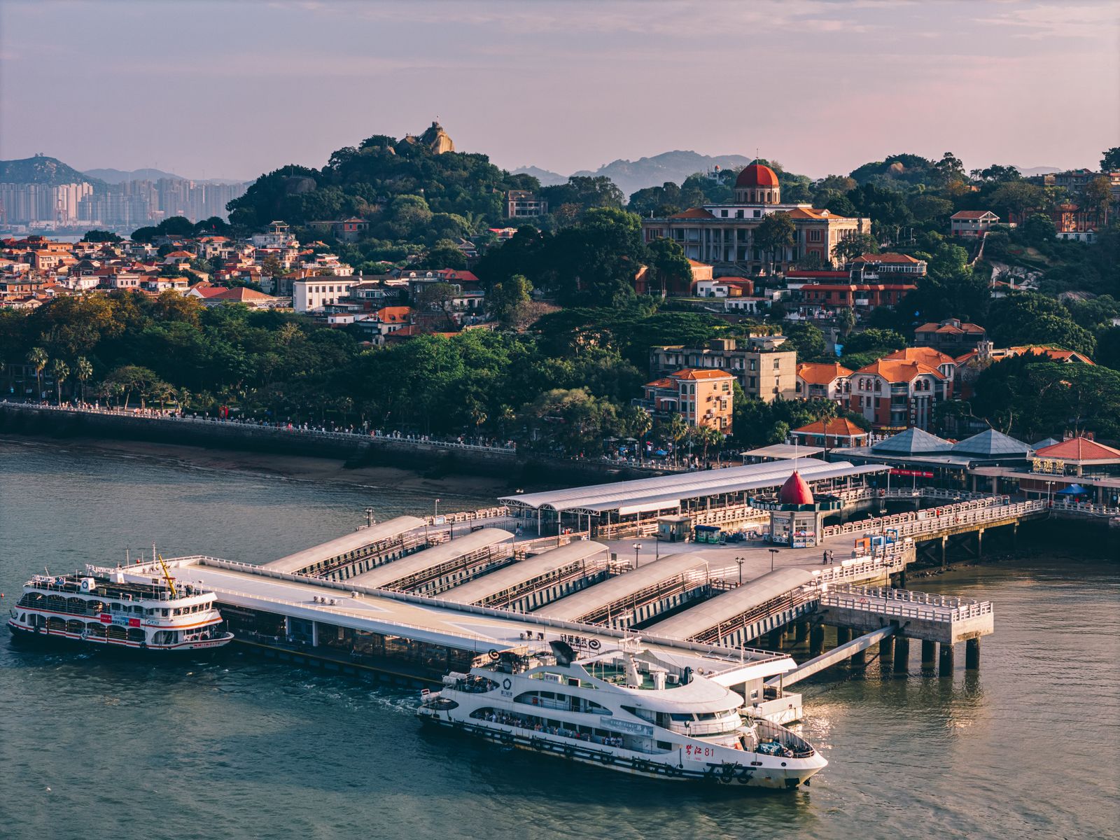 Aerial view of Gulangyu Island's harbor, with ferries crossing between Xiamen and the island